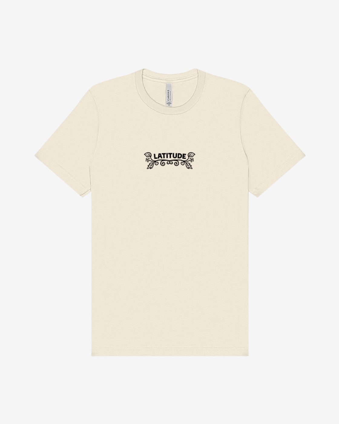 The Latitude 2025 Pink Sheep Natural T-Shirt from the Latitude Festival Store is a cream unisex tee made from soft Airlume cotton, featuring LATITUDE in bold black letters with decorative flourishes centered on the chest.