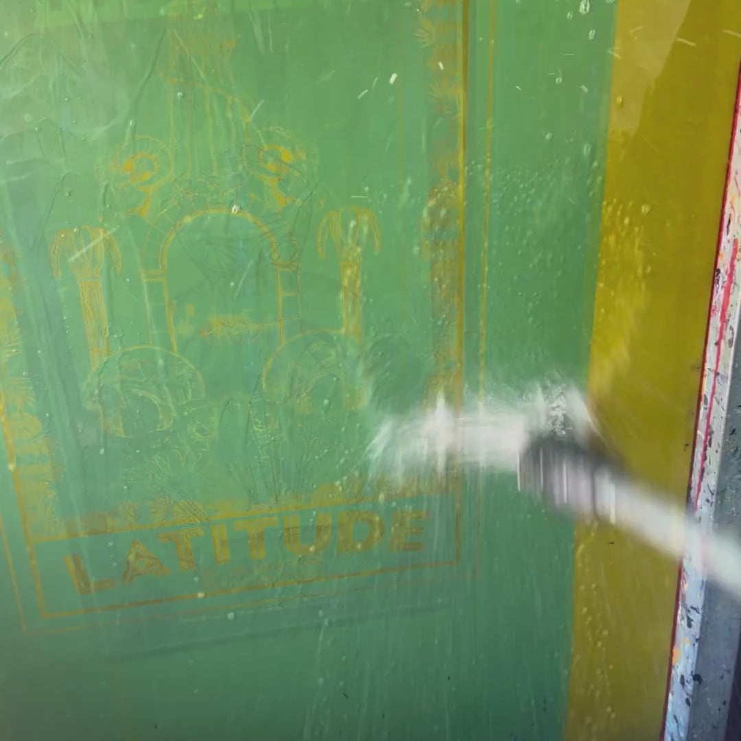 Video displaying behind the scenes of an artist screen printing a Latitude Festival poster.