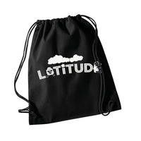 The Latitude Drawstring Bag from the Latitude Festival Store is a black bag featuring LATITUDE in white, decorated with cartoon sheep, a cloud, and a four-leaf clover above the letters—a charming accessory!.