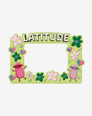 The 2025 Photo Frame is green, adorned with flowers, musical notes, and balloons. It features two cartoon sheep in sunglasses and bold LATITUDE at the top, with a blank center for your photo.