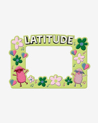 The 2025 Photo Frame is green, adorned with flowers, musical notes, and balloons. It features two cartoon sheep in sunglasses and bold LATITUDE at the top, with a blank center for your photo.