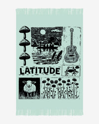 The 2025 Knitted Blanket features fringe and illustrations of mushrooms, a sunset lake with canoe, guitar, frog, sheep, wildflowers, and “LATITUDE” in bold at the center.