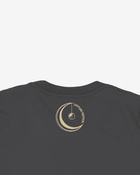 Black t-shirt with a gold circular design on the back against a white background