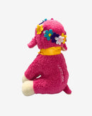 Pink plush toy with floral headband on a white background