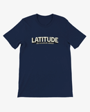 A navy blue short-sleeve crewneck t-shirt with 'LATITUDE' printed in cream across the chest, with 'the twentieth edition' in smaller script underneath, shown on a light gray background.