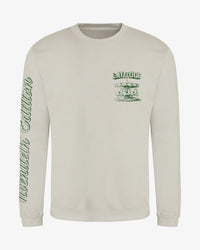 Light beige Latitude Merry Go Round Sweatshirt with a green carousel graphic on the left chest and the words twentieth edition printed vertically down the right sleeve.